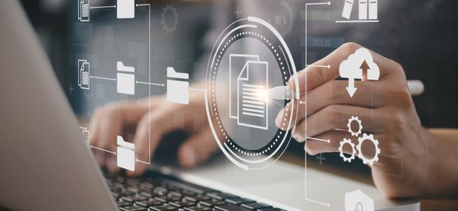 Businessman using a computer to document management concept, online documentation database and digital file storage system or software, records keeping, database technology, file access, doc sharing.